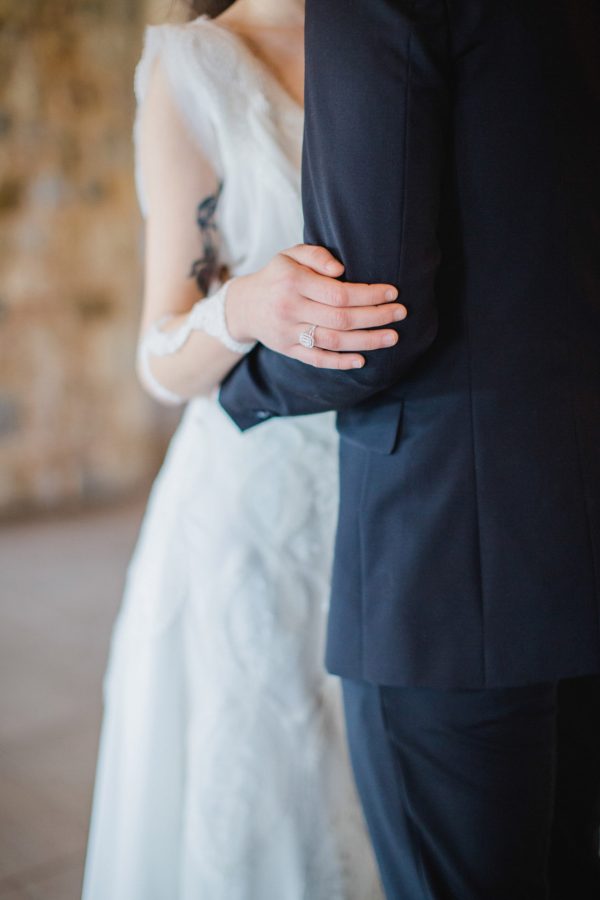 Detail photograph of bride and groom's designer wedding outfits and diamond jewellery by Katia Delatola and Danelian Diamond Club.