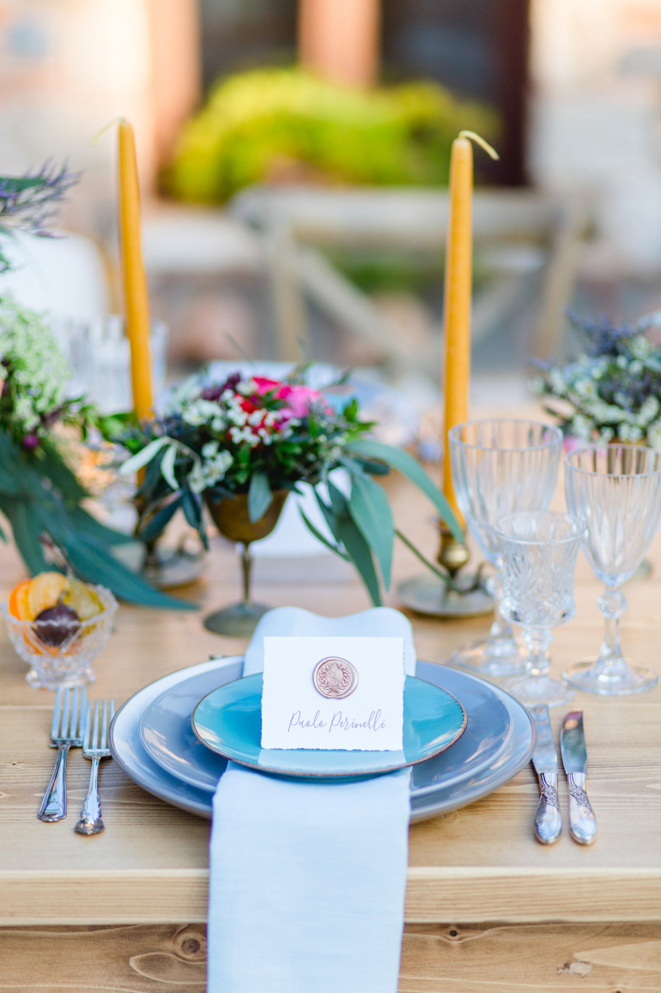 Wedding day dinner reception set up with delicate details, elegant plates, seasonal flowers and personalized place cards styled and photographed in Pyrgos Petreza Athens.