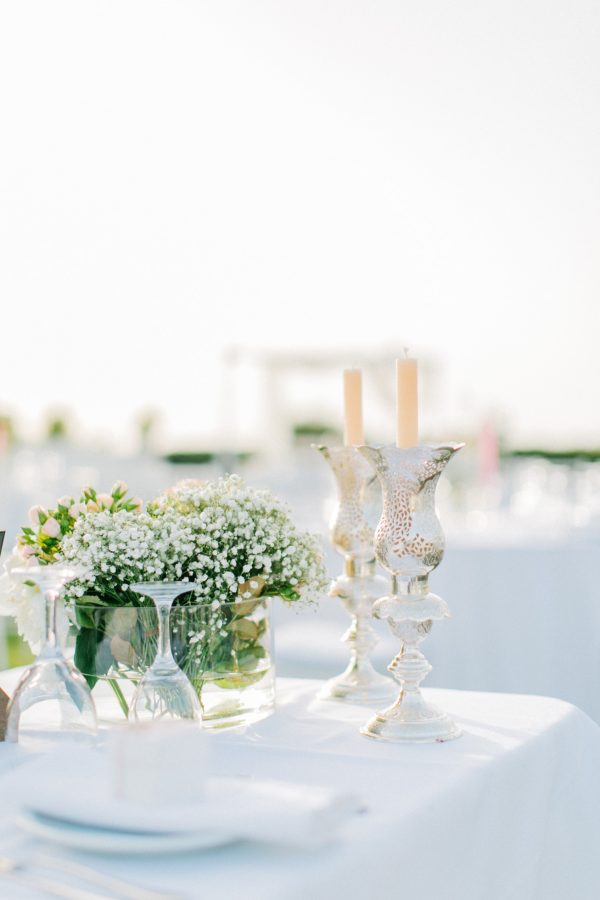 Professional wedding day image of reception location in Ktima Reveli, area of Chania Crete. Intricate luxurious detail of decorations styled and shot by a professional photographer.