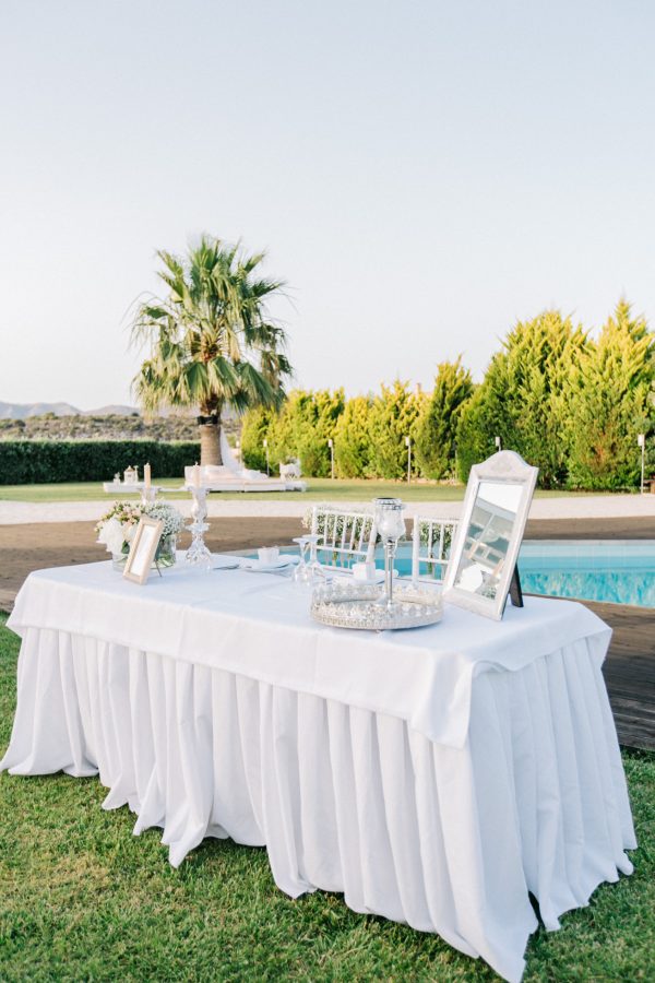 Professional wedding day image of reception location in Ktima Reveli, area of Chania Crete. Intricate luxurious detail of decorations styled and shot by a professional photographer.