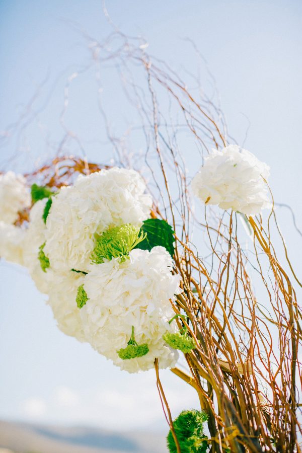 White, gold and green wedding ceremony set up in a palm tree wedding estate in Rethymno Crete.
