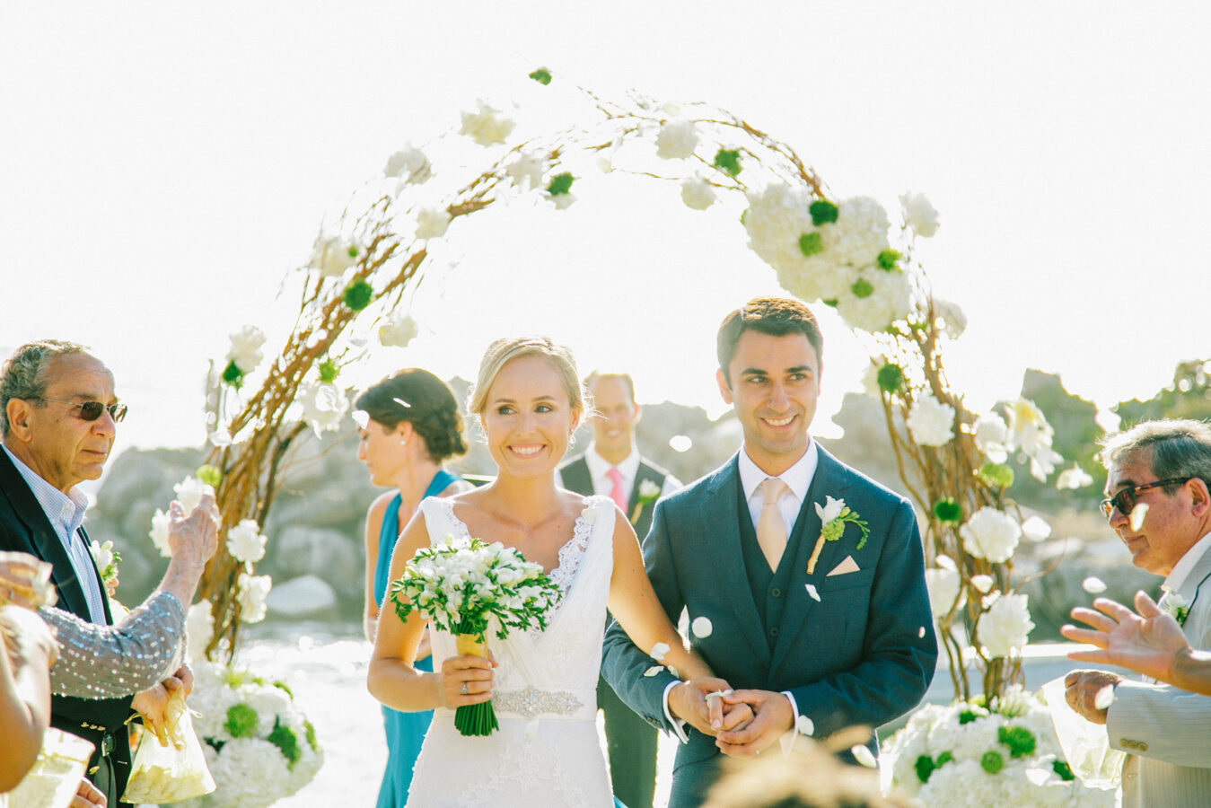 Portrait of a bride and groom during their afternoon wedding ceremony in palm tree wedding estate in Rethymno Crete photographer by a professional destination wedding photographer.