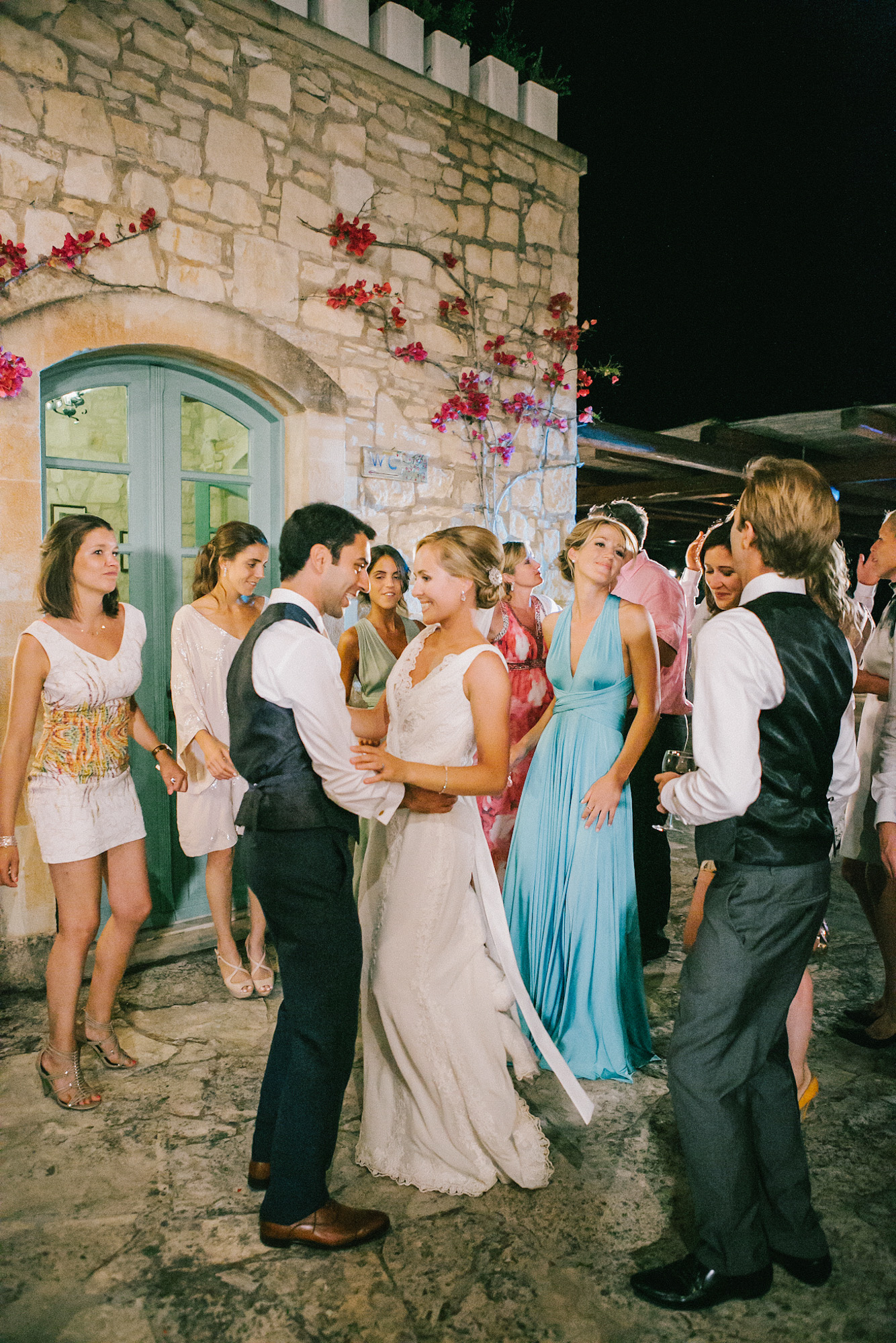Bride and groom dancing together during their wedding reception in Agreco farm estate in Crete.