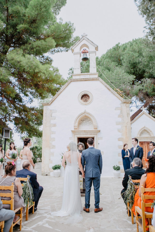 Elegant couple on their Greek orthodox destination wedding ceremony in Profitis Ilias, Chania & Crete.