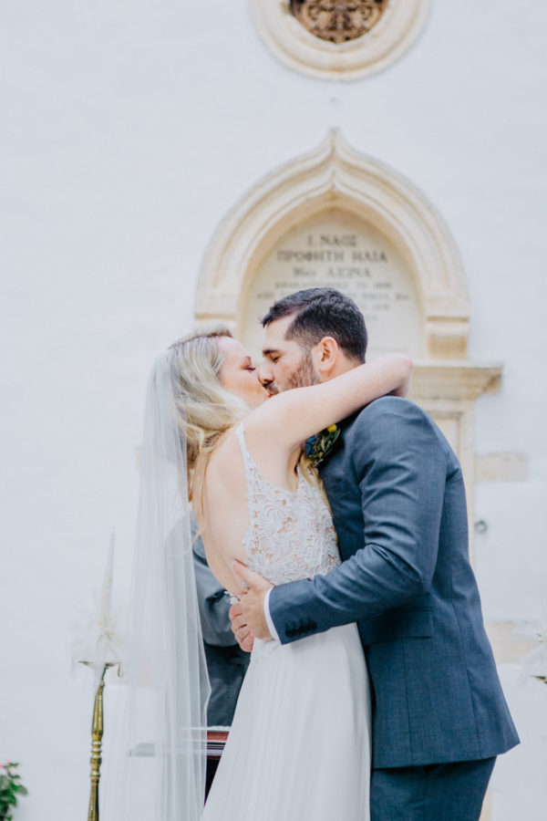 Beautiful bride and groom posing for wedding day portraits in Profitis Ilias, Crete island, Greece.