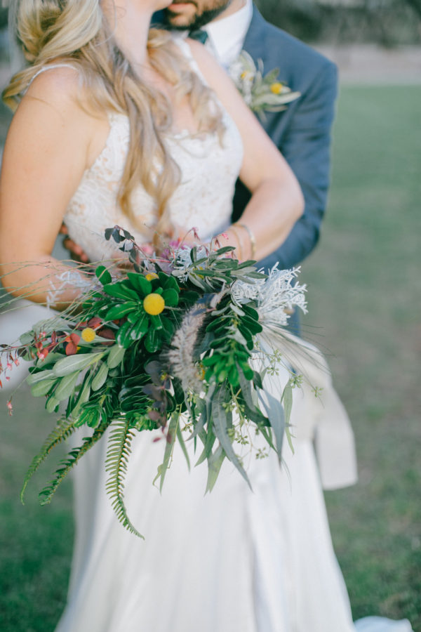 Beautiful bride and groom posing for wedding day portraits in Profitis Ilias, Crete island, Greece.