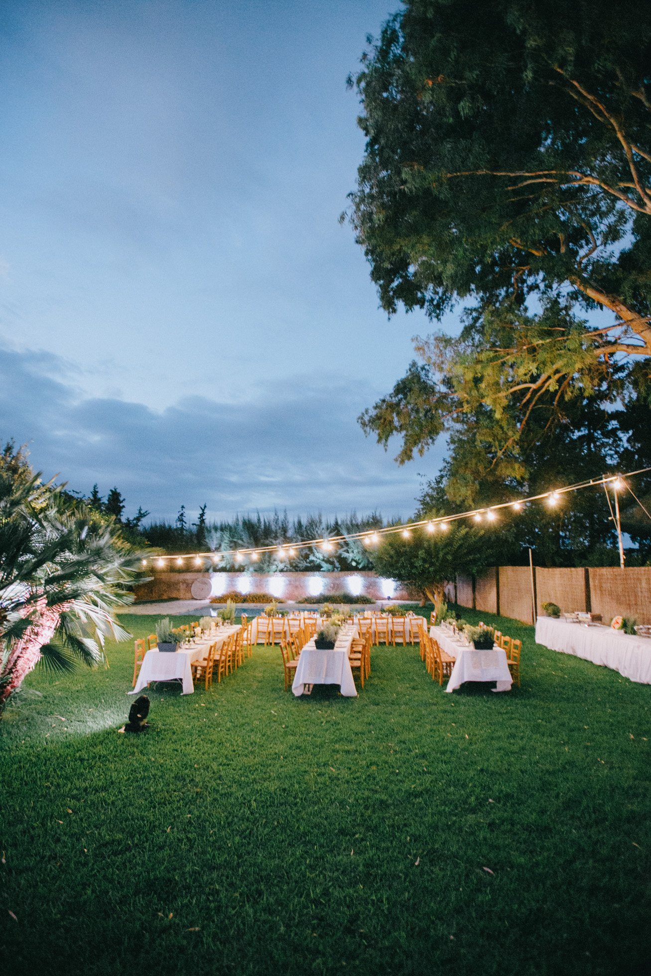 Rich wedding reception dinner setup for an exclusive wedding event in Metohi Kindelis, Chania, Crete photographed by professional photographer team.