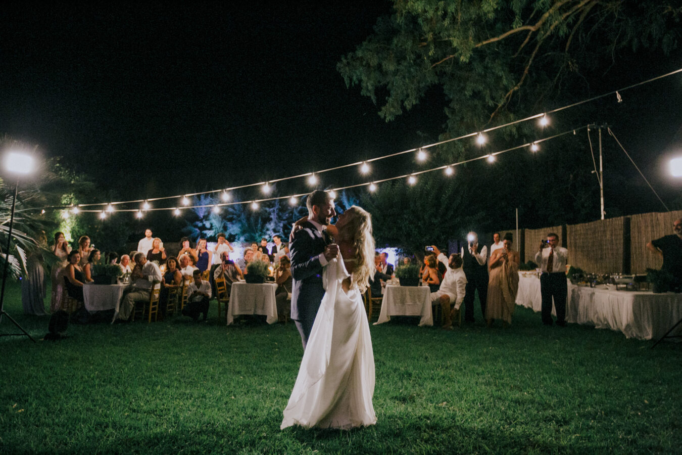 Bride and groom's first dance on an exclusive wedding night in Metohi Kindelis, Chania, Crete photographed by professional photographer team.
