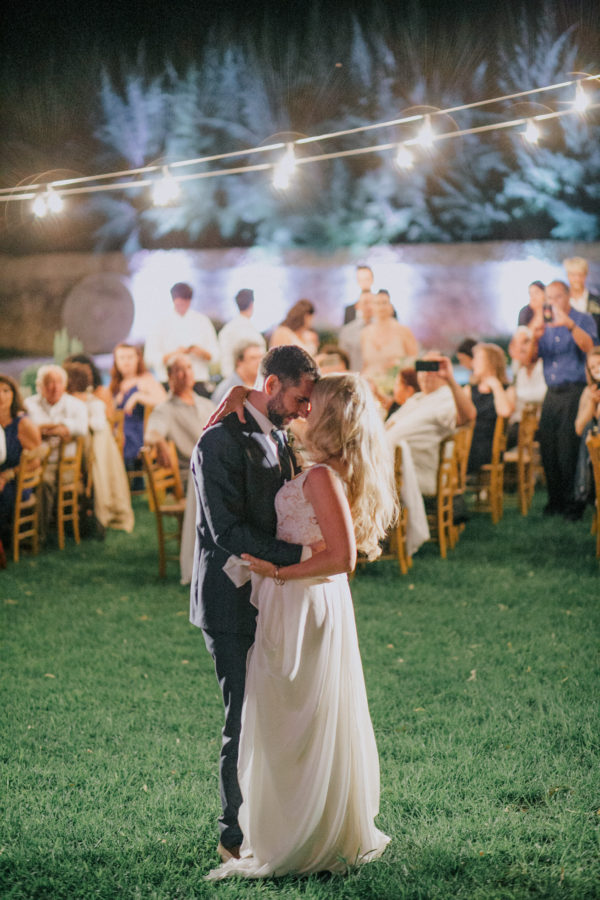 Bride and groom's first dance on an exclusive destination wedding night in Metohi Kindelis, Chania, Crete photographed by professional photographer team.