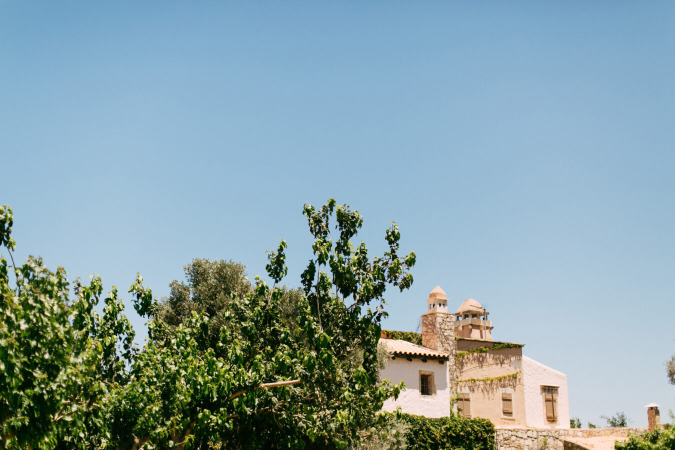 Rustic Agreco farm by Grecotel photographed on a sunny wedding day in Crete.