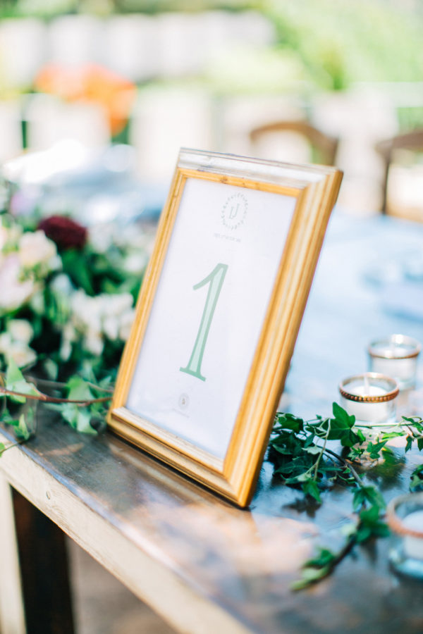 Rich dinner reception table settup and details created by Fabio Zardi and captured by wedding photographer during a destination wedding in Agreco farm in Crete.