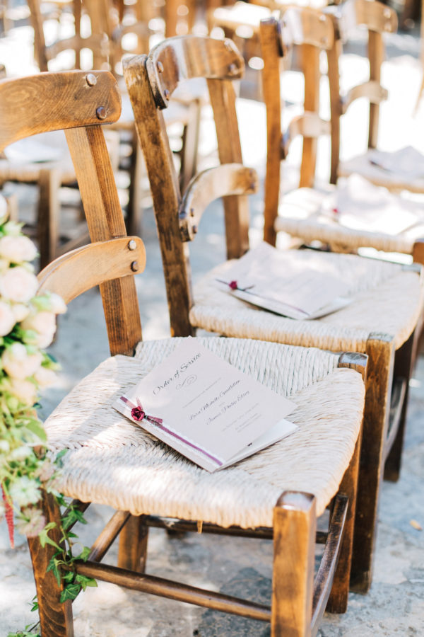 Ceremony venue with decorations and florals ready for a destination wedding in Grecotel Agreco Farm in Crete, Greece, documented by professional wedding photographer.