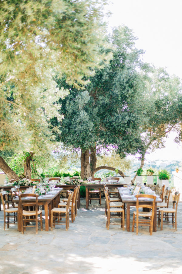 Rich dinner reception table settup and details created by Fabio Zardi and captured by wedding photographer during a destination wedding in Agreco farm in Crete.