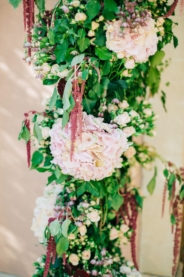 Rich floral decorations and details created by Fabio Zardi and captured by wedding photographer during a destination wedding in Agreco farm in Crete.