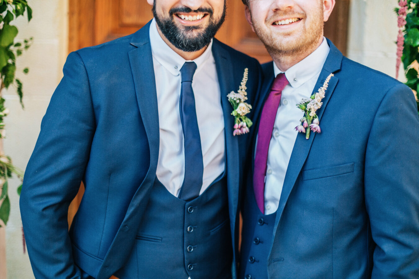Trendy groom and his classy best man posing for formal portraits after the wedding ceremony at Agreco Farm in Crete, Greece.