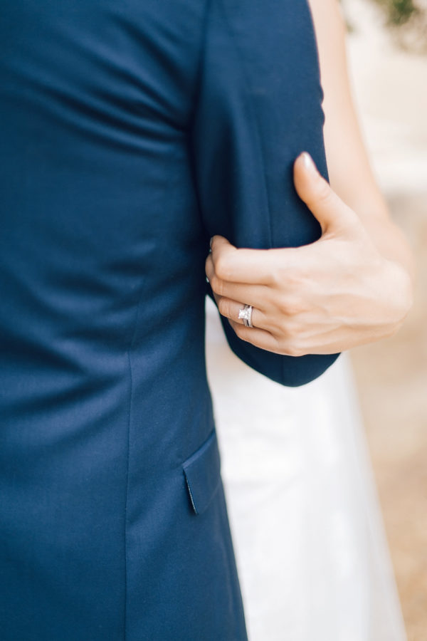 Fine art wedding portraits of the newly wedded couple posing for professional destination wedding photographer at Fortezza of Rethymno in Crete, Greece.