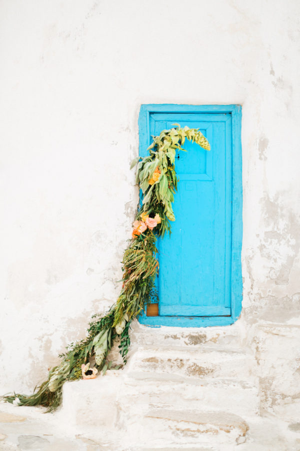 Blue door of the Mykonos windmill with wedding decoration.