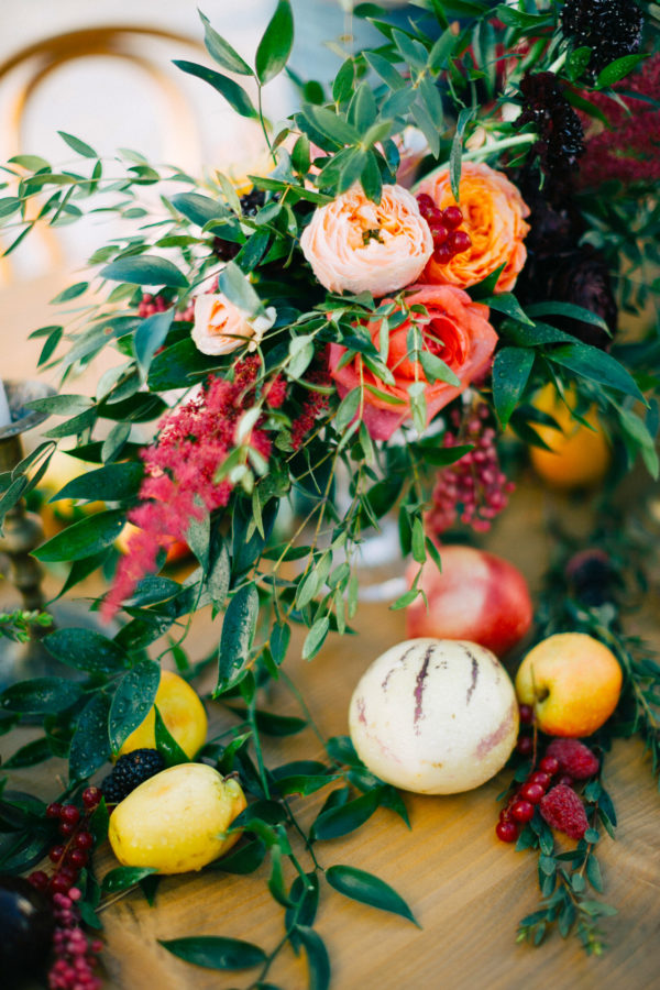 Rich and colorful table setting and flowers for a destination wedding in Mykonos, Greece.