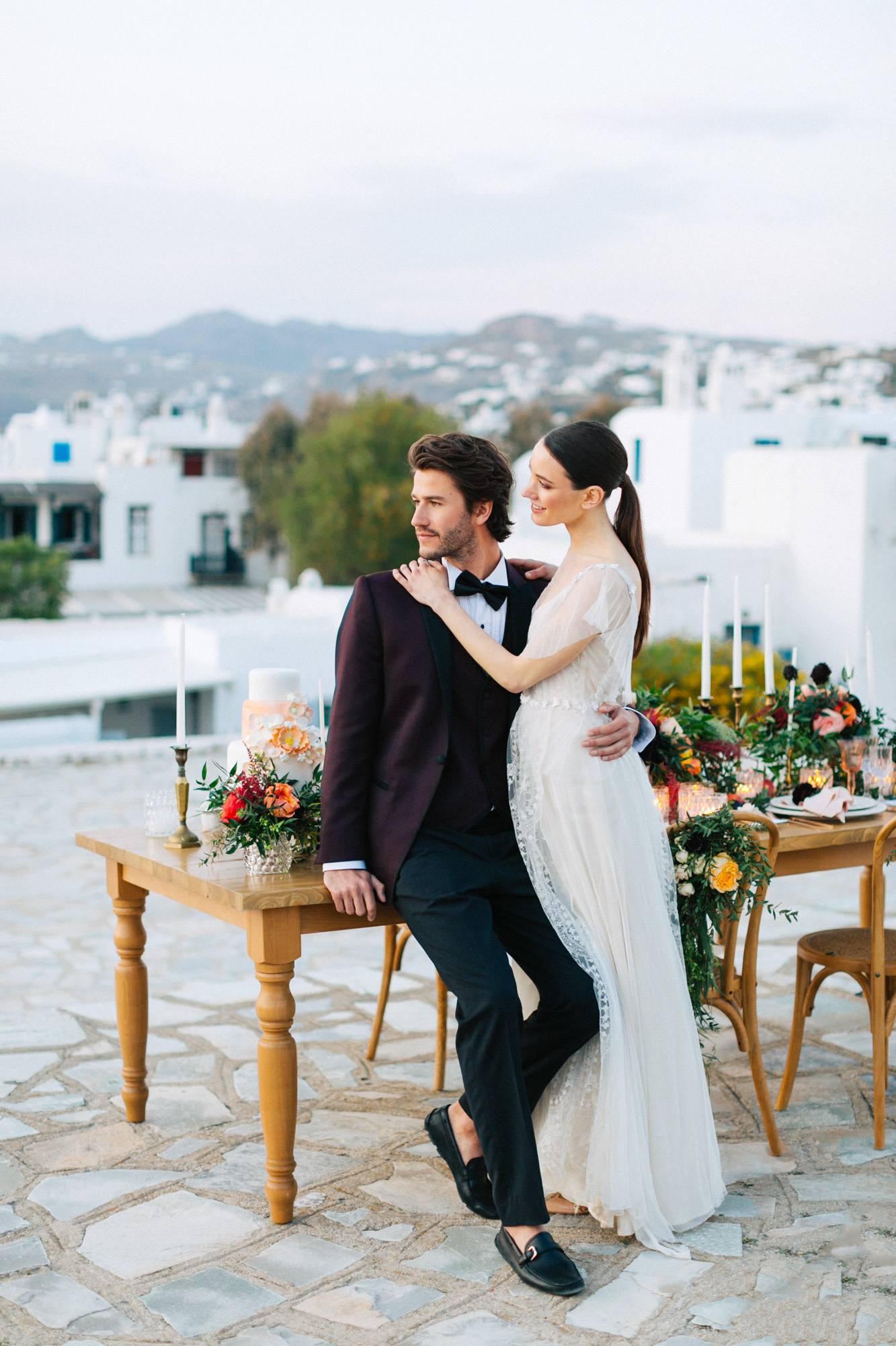 Bride and groom posing for a wedding photographer in Mykonos.