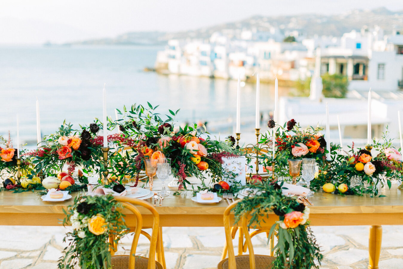 Rich and colorful table setting and flowers for a destination wedding in Mykonos, Greece.