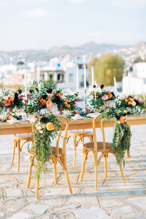 Rich and colorful table setting and flowers for a destination wedding in Mykonos, Greece.