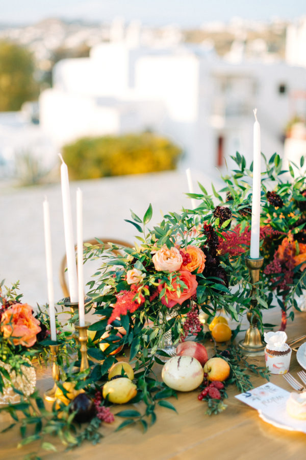 Rich and colorful table setting and flowers for a destination wedding in Mykonos, Greece.
