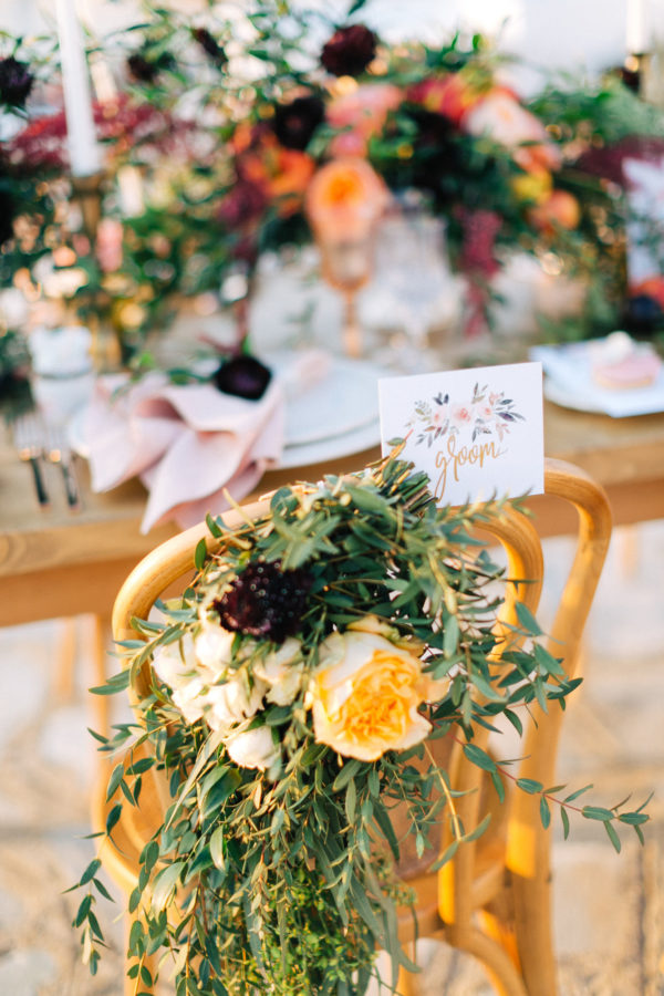 Rich and colorful table setting and flowers for a destination wedding in Mykonos, Greece.