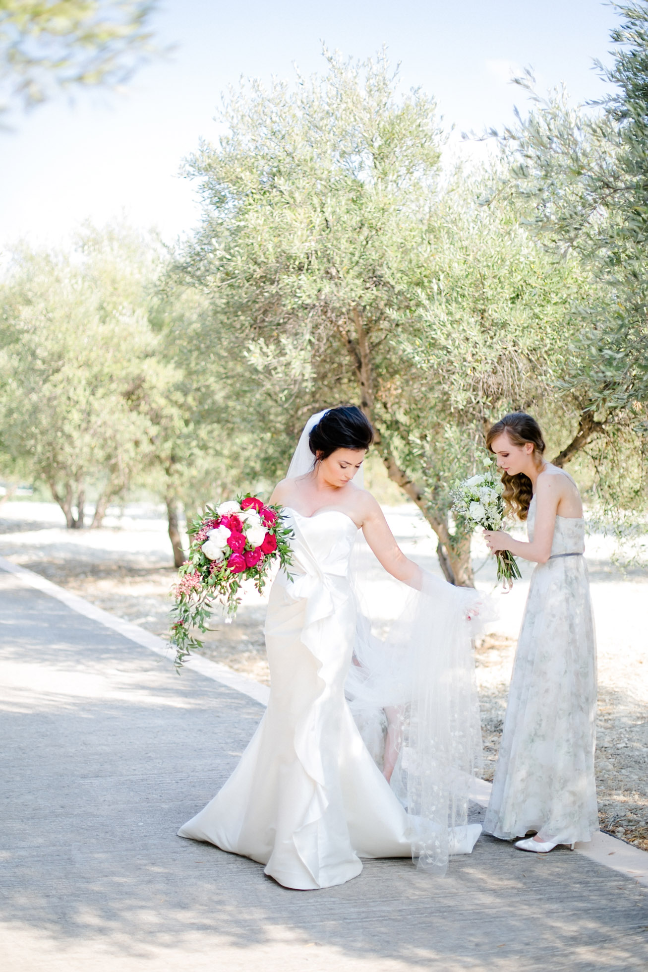 Bride with bridesmaids on a wedding day in Crete island.