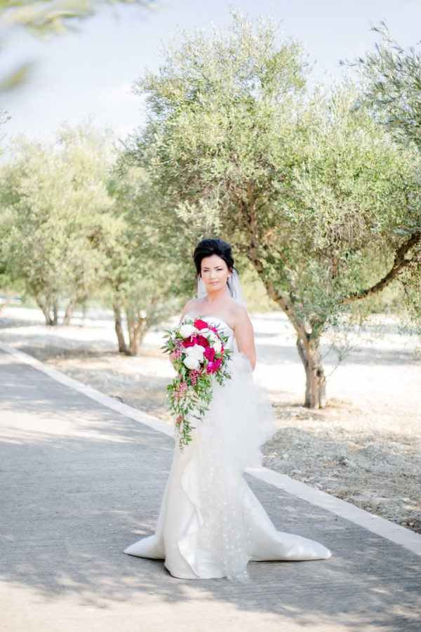 Beautiful modern bride posing for wedding photographer on her wedding day.
