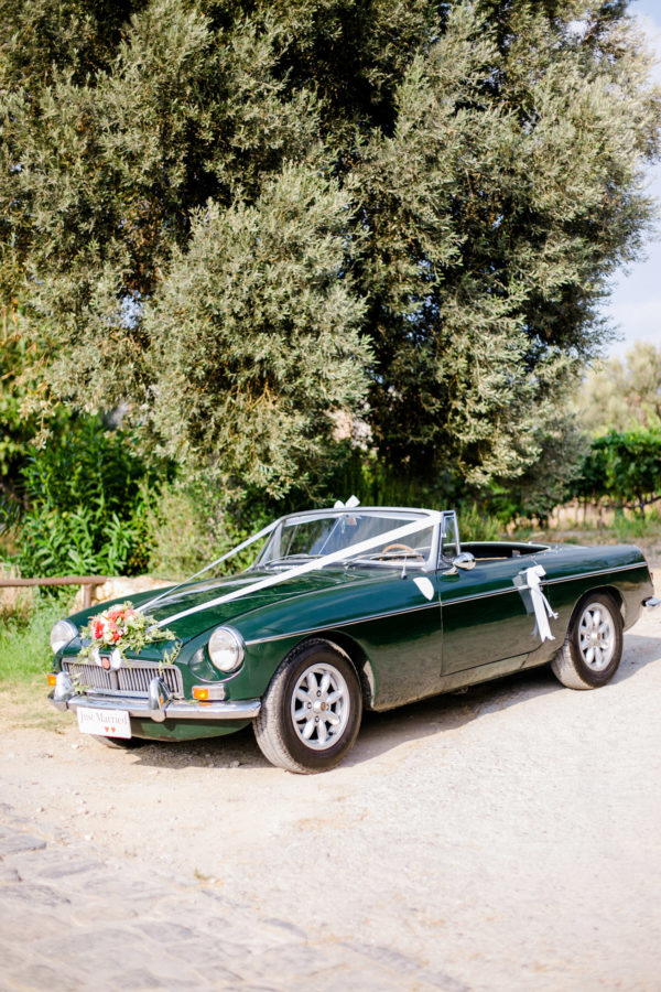 Just Married - decorated vintage wedding car.