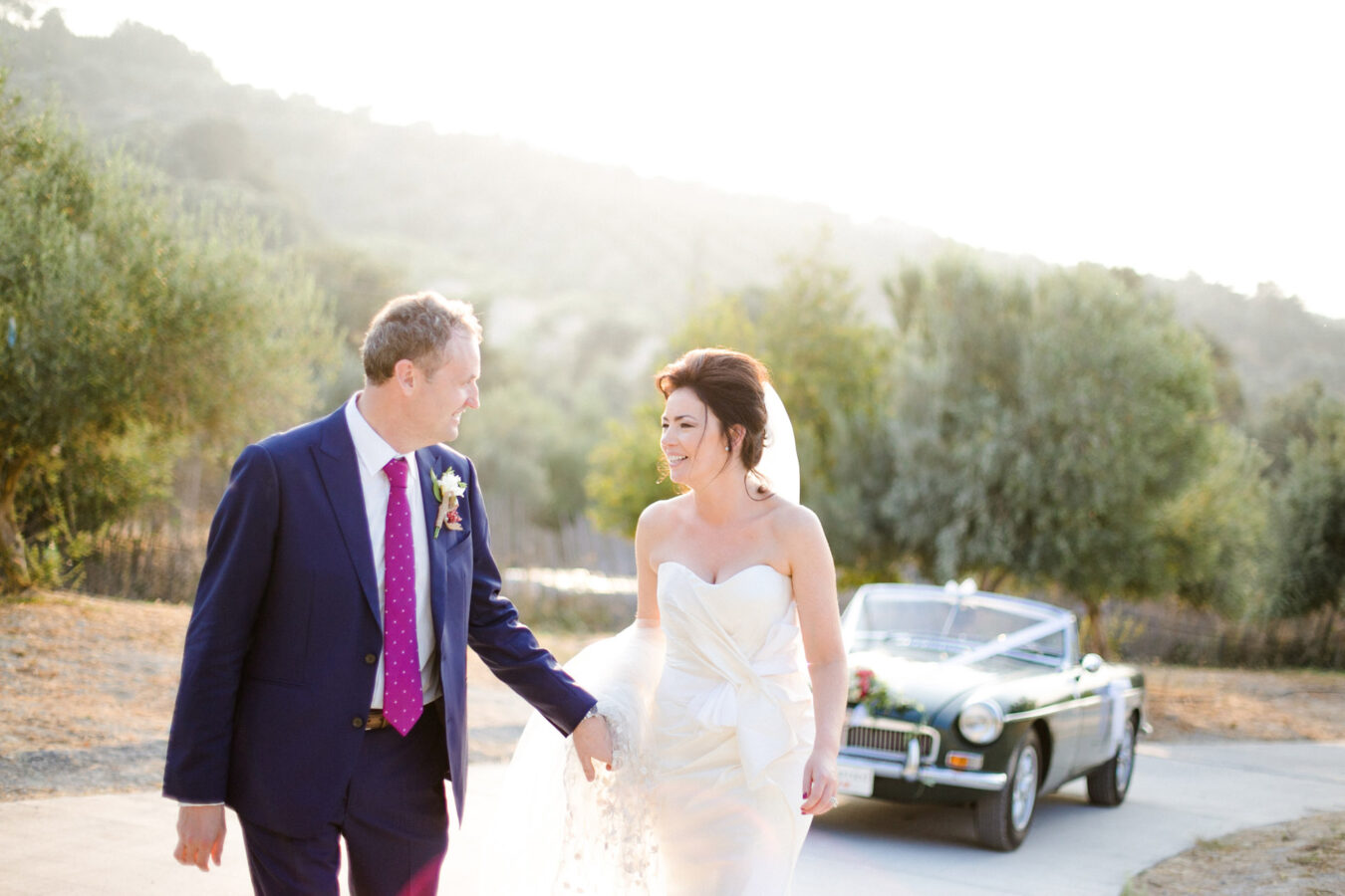 Elegant newlywed couple posing for portraits on their wedding day in Crete.
