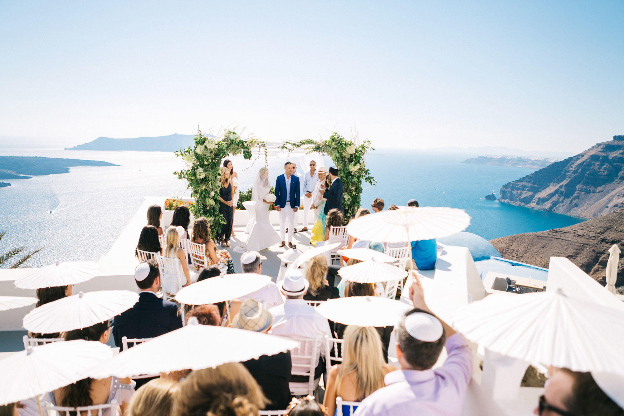 Wedding ceremony view in Santorini caldera.