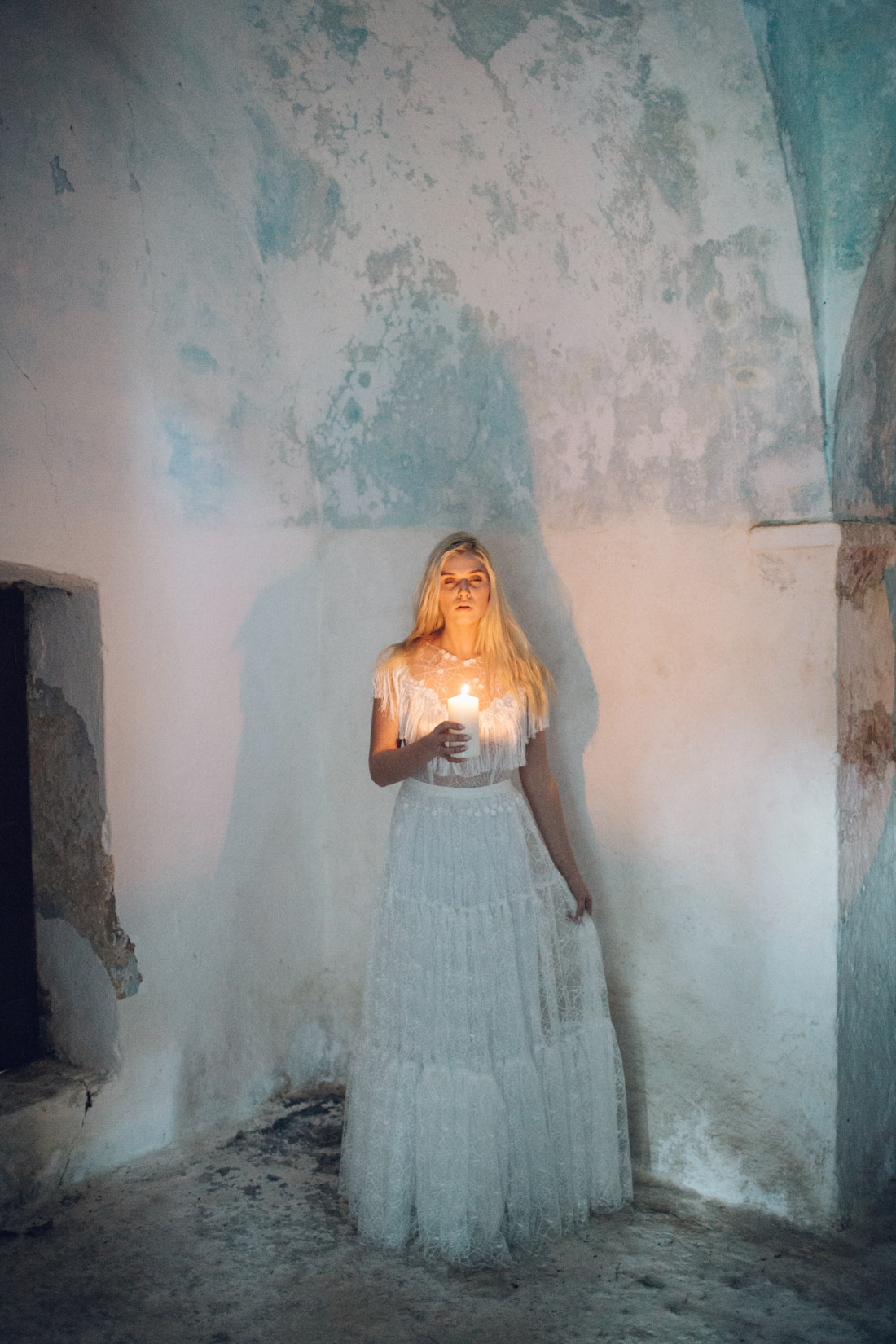 Wedding bride holding a candle