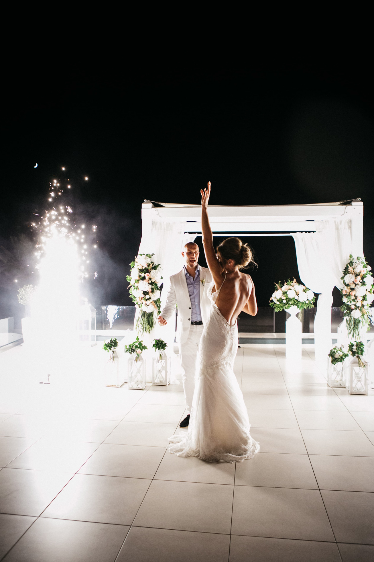 Bride and groom's first dance during their wedding reception at Le Ciel wedding estate in Santorini island, Greece.