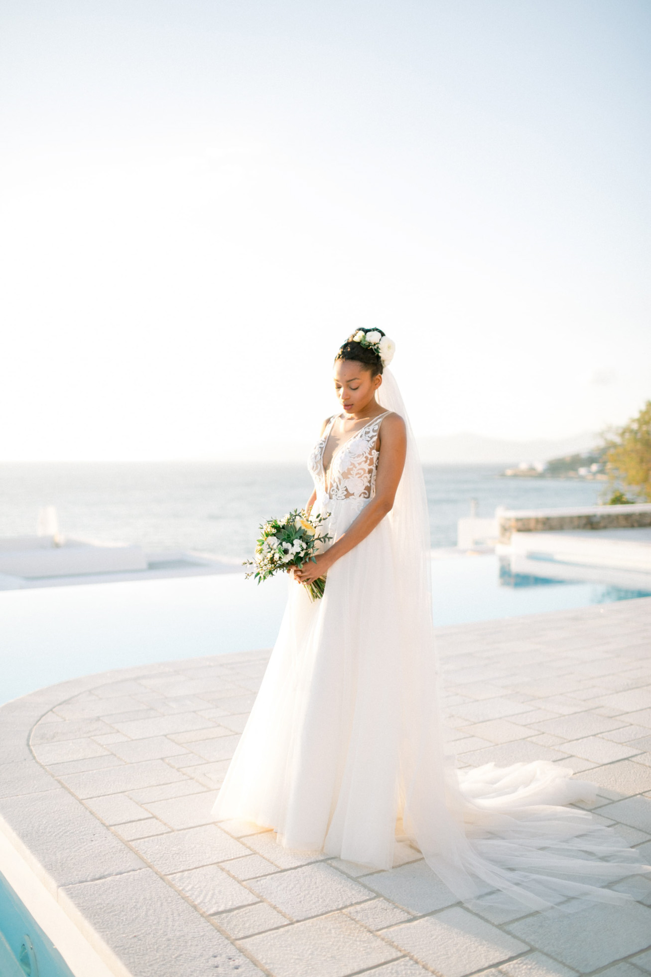 Stunning black bride at a villa wedding inspiration session by DeplanV in Loyal Villas Luxury, Mykonos, Greece.