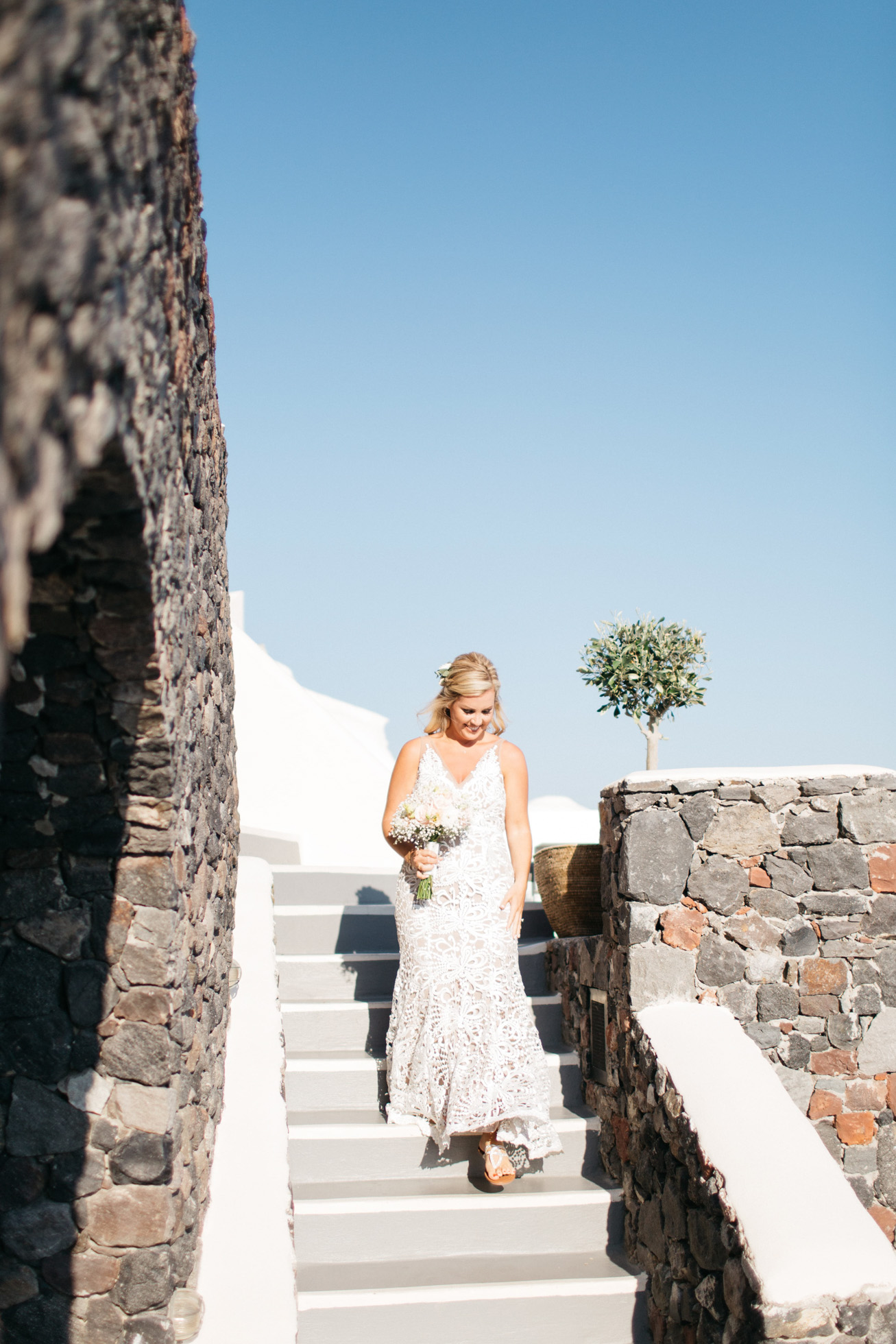 Radiant bride getting married in Canaves Suites Oia Santorini.