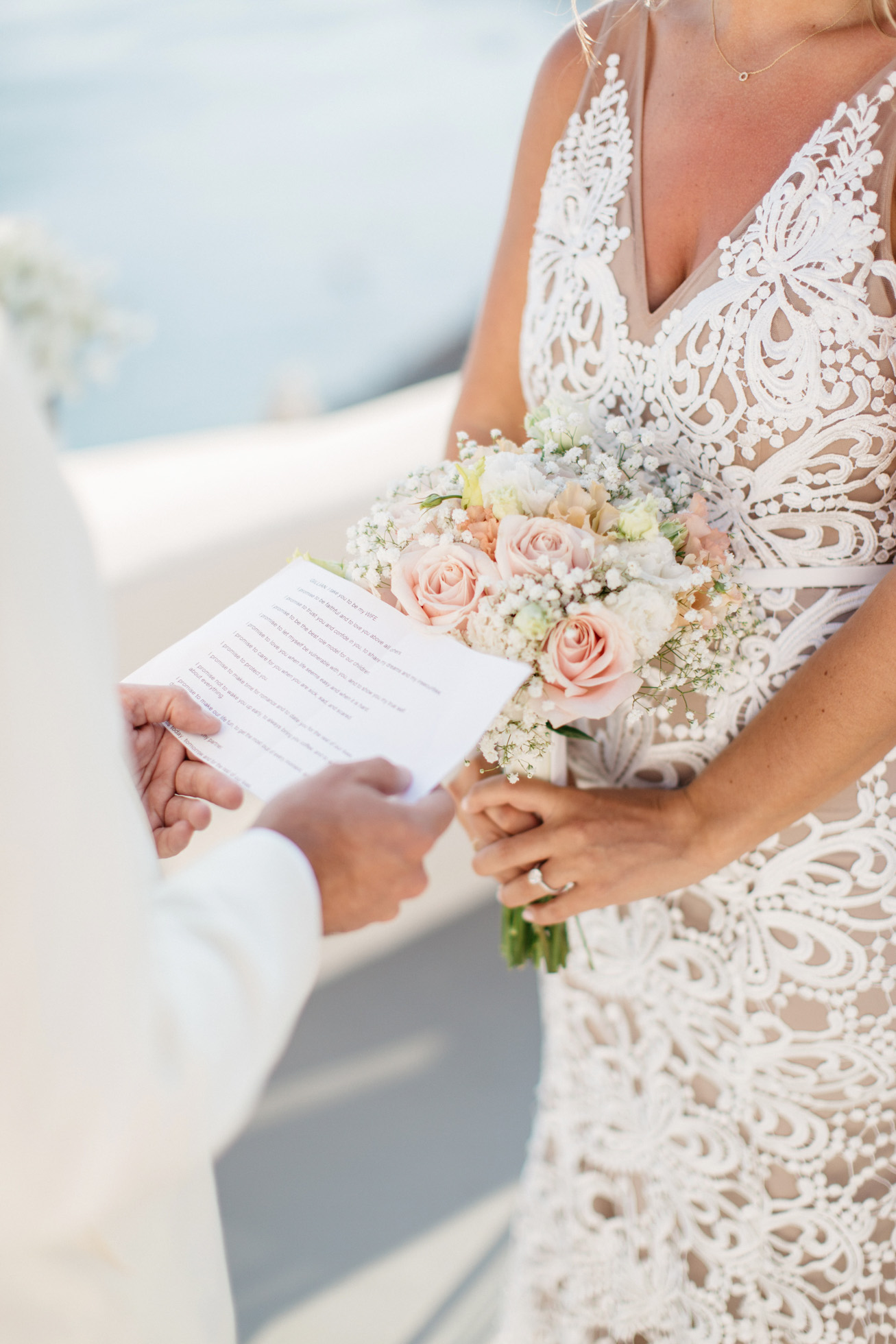 Wedding vows during ceremony in Canaves Suites Oia Santorini.