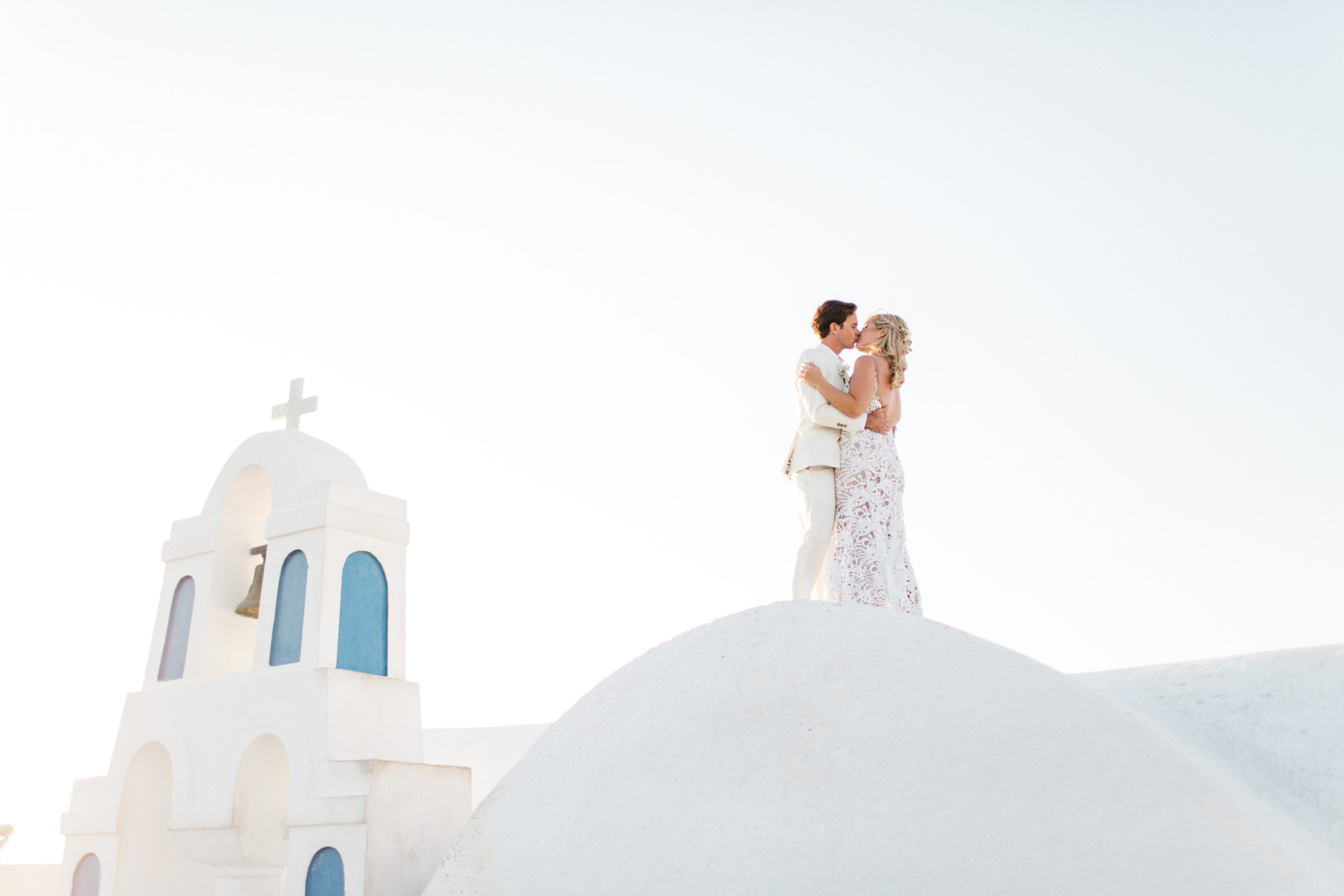 Newlyweds in Oia on their wedding day in Canaves Suites Oia Santorini.