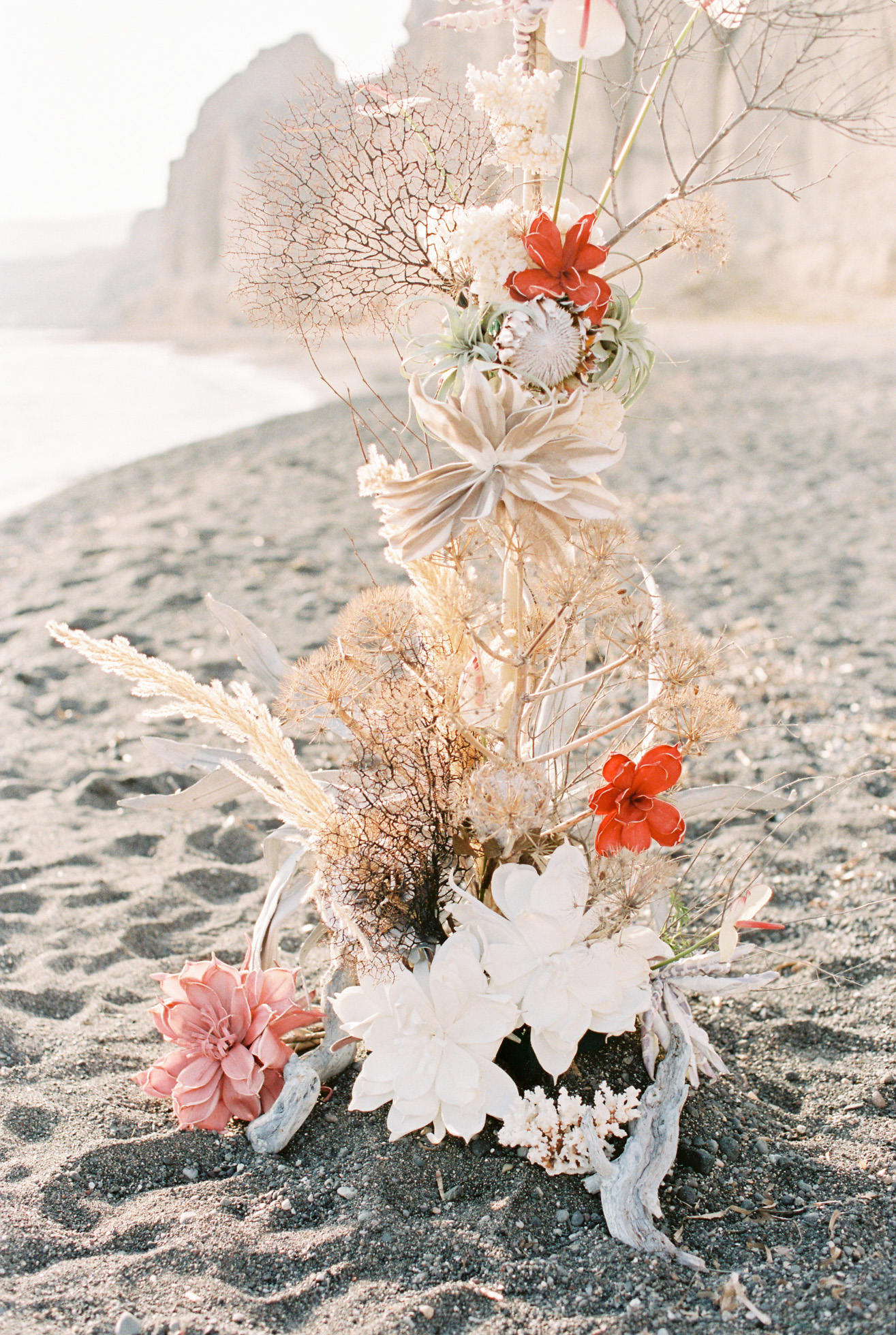 Unique ocean-inspired wedding canopy and ceremony setup at a beach wedding inspiration shoot in Santorini Greece.