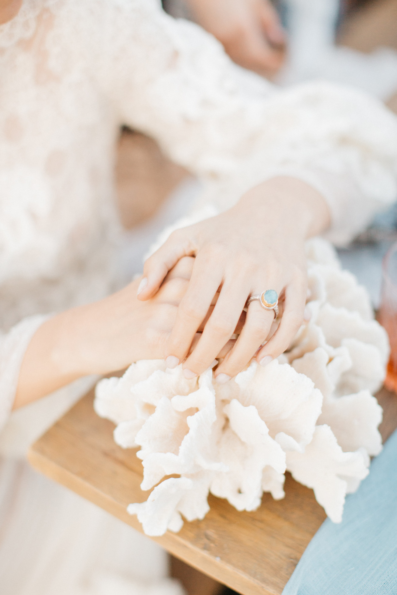 One-of-a-kind jewelry pieces of Santorini wedding stative inspiration session on the beach.