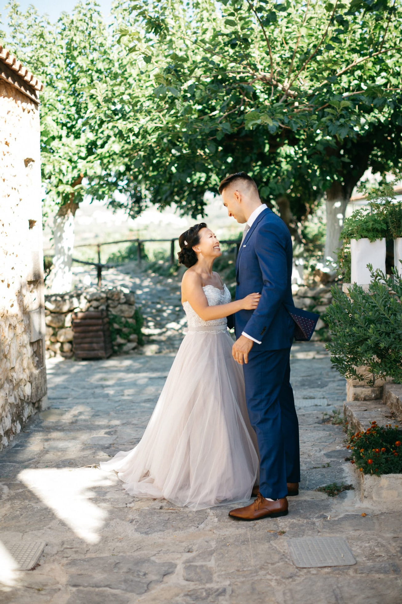 First look of the bride and groom in Agreco Farms, Grecotel, Crete, Greece.