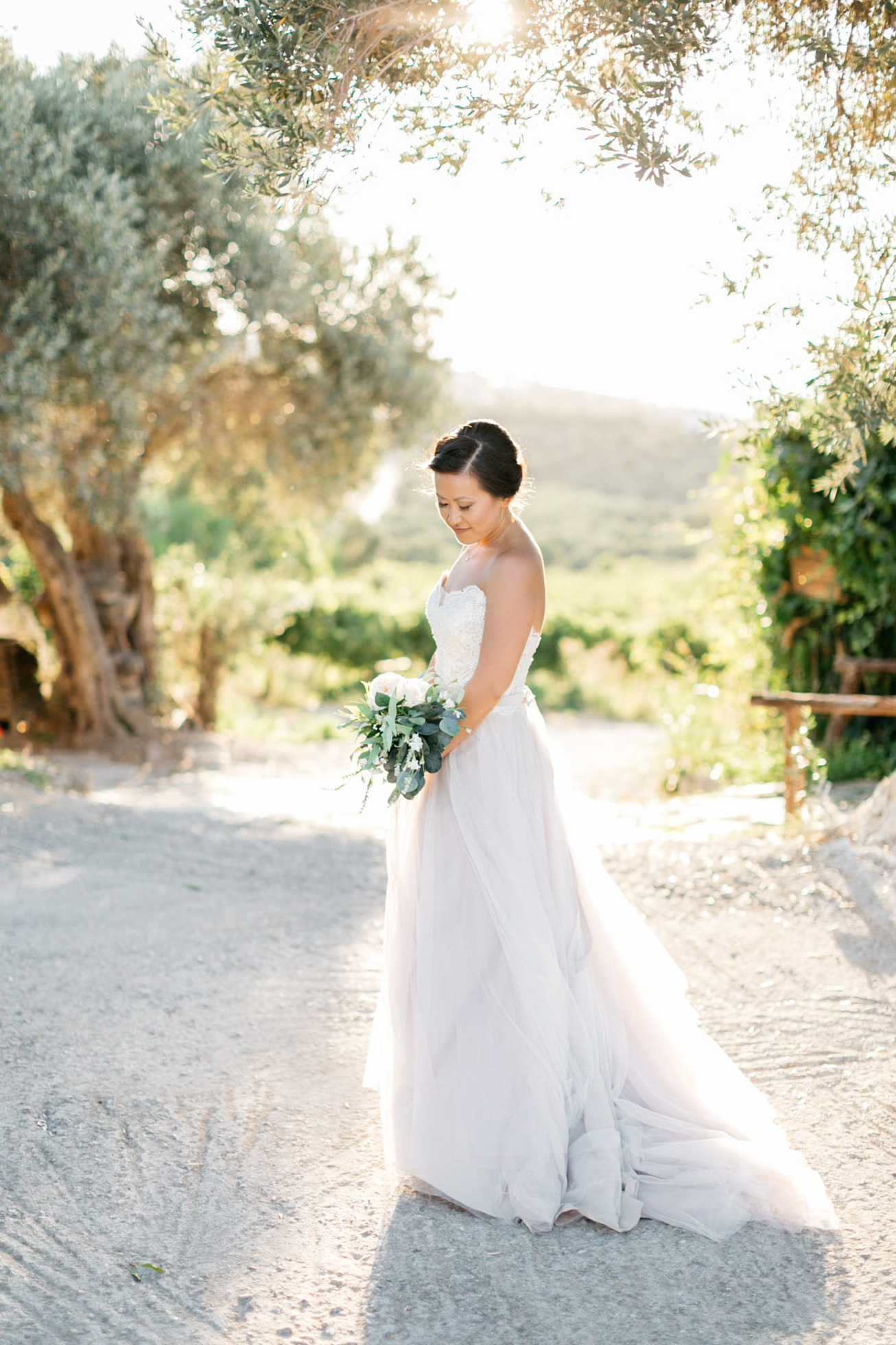 Elegant bride at her destination wedding in Agreco Farms, Grecotel, Crete, Greece.