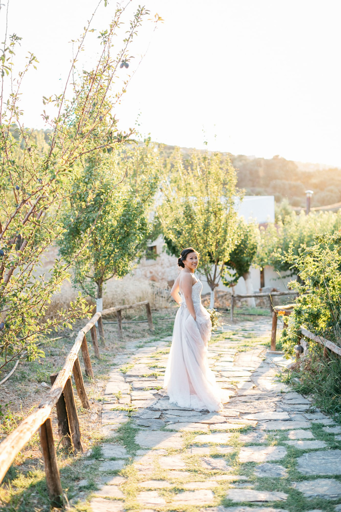 Elegant bride at her destination wedding in Agreco Farms, Grecotel, Crete, Greece.