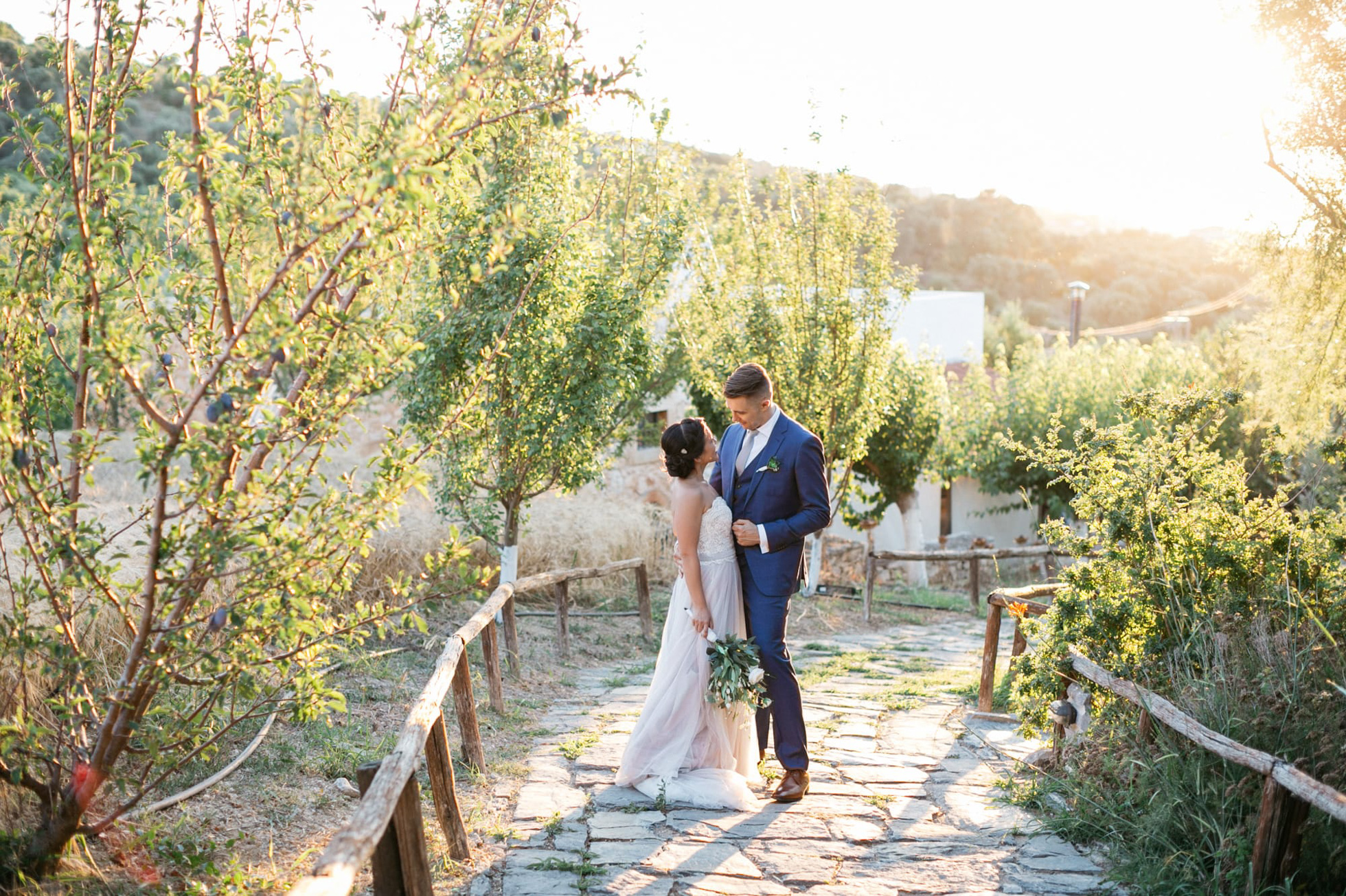 Bride and groom at their vineyard destination wedding in Agreco Farms, Grecotel, Crete, Greece.