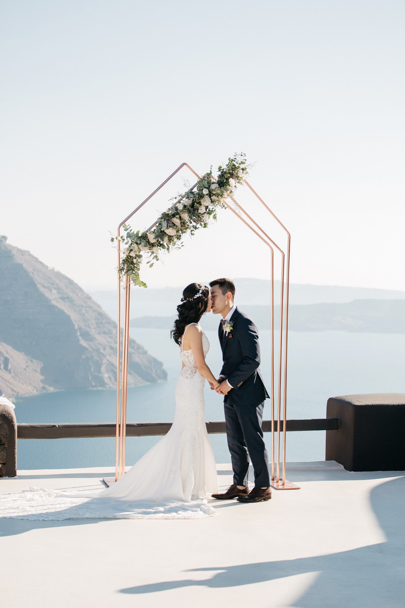 Destination wedding ceremony in Aenaon Villas in Oia Santorini Greece.