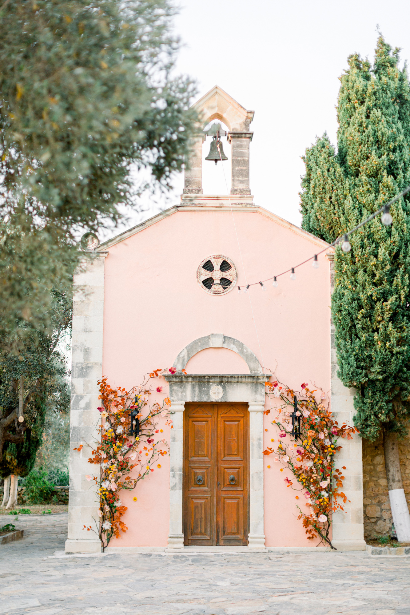 Wedding ceremony venue and decoration for a sunset wedding editorial in Grecotel Agreco Farms Crete Greece as published on Ruffled blog.